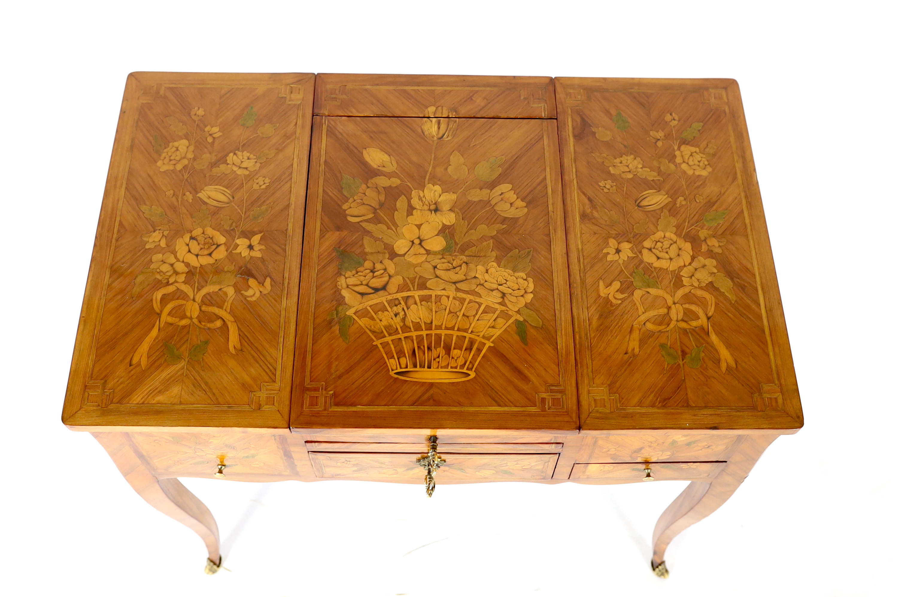 A Louis XV marquetry inlaid kingwood poudreuse, 76cm wide, 46.5cm deep, 71cm high, Please note this lot attracts an additional import tax of 5% on the hammer price